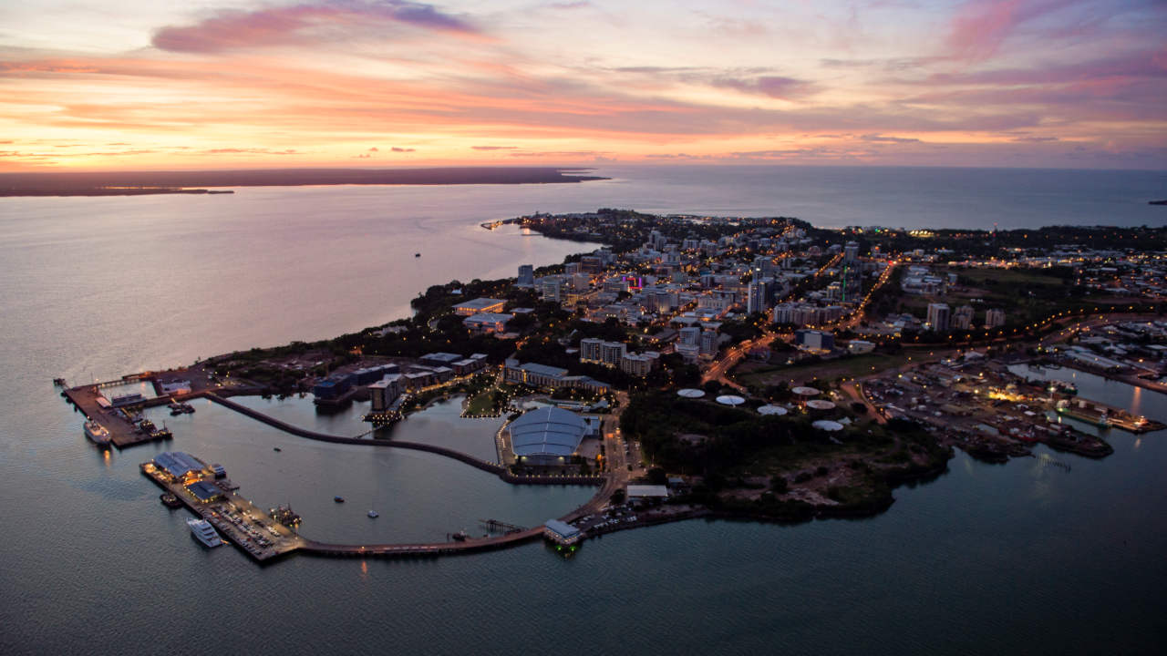 Darwin city lights up as the sun sets.